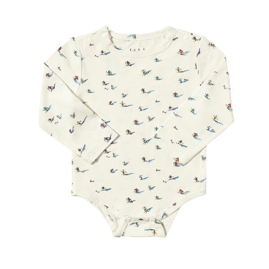 Onesie in white with sweet watercolour skiers print. With popper fastenings and made from soft bamboo fabric.