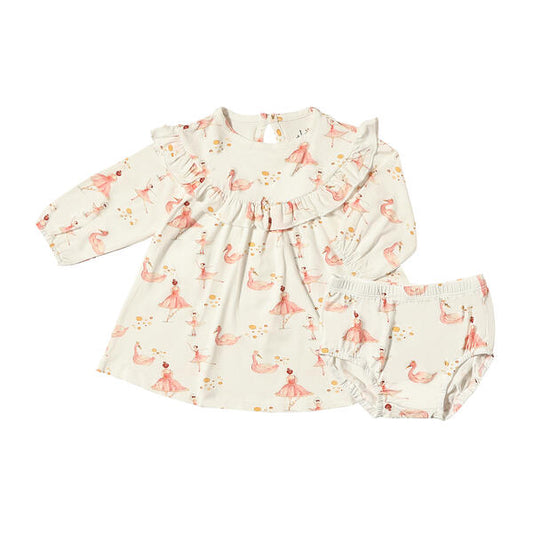 Sweet dress with ruffled bib in white with pink watercolour ballerina print. With long sleeves and madre from soft bamboo fabric.