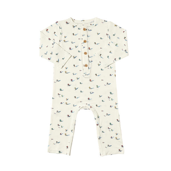 Long leg romper in white with sweet watercolour skiers print. With buttons on the placket and made from soft bamboo fabric.