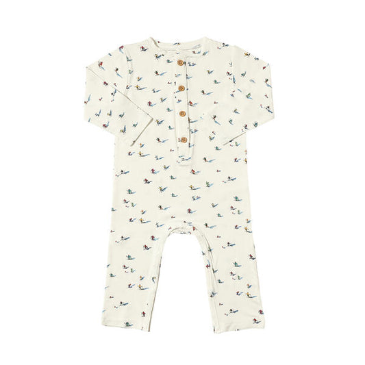 Long leg romper in white with sweet watercolour skiers print. With buttons on the placket and made from soft bamboo fabric.