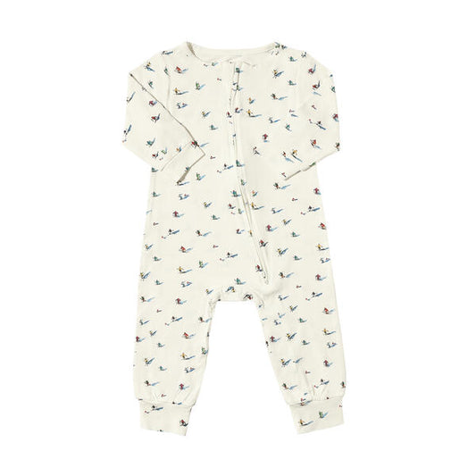 Romper with zip fastening in white with sweet watercolour skiers print. With long legs and sleeves, and made from soft bamboo fabric.