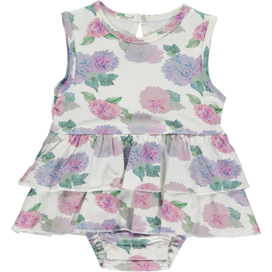 sleeveless summer onesie dress with hydrangea print in pink and violet on white background, made of bamboo fabric, two frills on the skirt