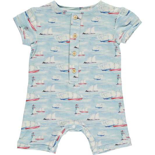 sleeveless shortie romper in traditional sailing boat print on a blue background, made of bamboo fabric, buttons on the placket