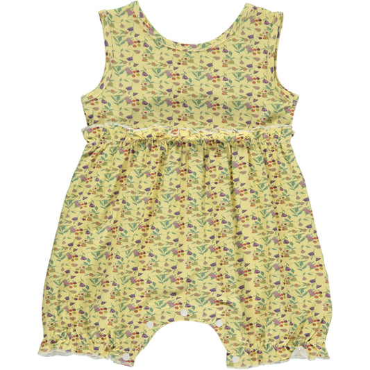 sleeveless girls shortie romper in multicolor wildflower print on a yellow background, made of bamboo fabric, small frills at the waist and leg